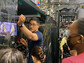 High school students in the University of Maryland's Advanced Physics Summer Girls' Camp view an ion trap.